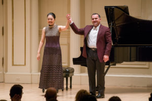 Mai Kagaya & Alexander Beridze finish playing four hands for piano at the New York Music Foundation 10th Anniversary Gala at the Carnegie Hall (Photograph: © 2019 Richard Termine. Photo Credit - Richard Termine)